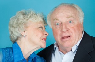 Woman whispering to husband