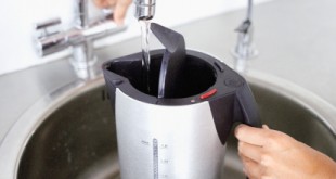 Close-up of an electric kettle being filled with water