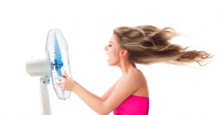 Girl with fan over white