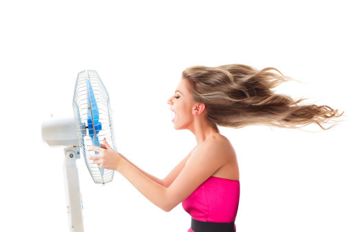 Girl with fan over white