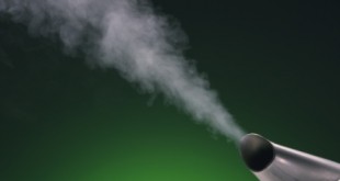 Steam coming out of kettle, green background