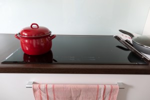 Cooking in red pots on induction hob